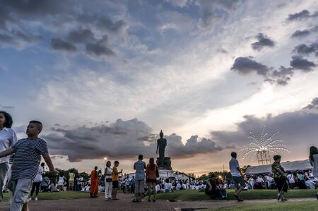 Vesakabucha day, Many people came forward to join candlelit procession at Praphuttamonthon courtyard, Nakornpathom, Thailand.のeditorial素材
