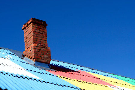 Colored roof with chimneyの写真素材