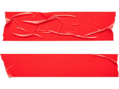 This image features two strips of red tape, one with visible wrinkles and creases, placed on a white background. The image is clear and SEO-friendly, highlighting the contrast between the vibrant red tape and the plain white background.の素材