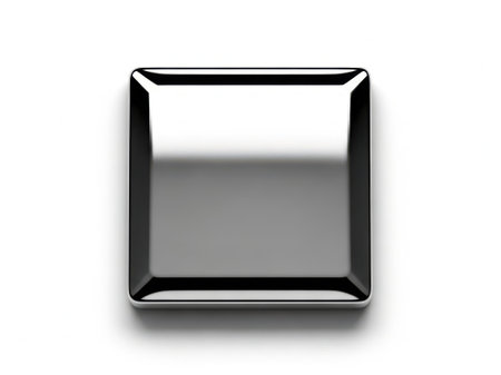 This image features a square metal button with a glossy finish, isolated on a white background. The button has a sleek, reflective surface and is centrally positioned in the image. The white background provides a stark contrast, highlighting the button's metallic texture and design.の素材