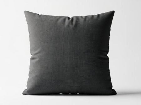 This image features a single, square gray cushion pillow with a textured surface. The pillow is placed centrally against a plain white background, making it the focal point of the image. The image is clear and SEO-friendly, ideal for use in home decor or product listings.の素材