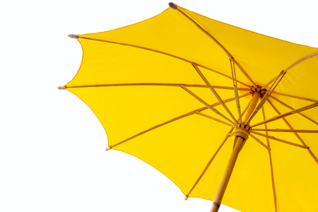 yellow umbrella with white backgroundの写真素材
