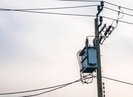 Transformer on the pole near the evening.の写真素材