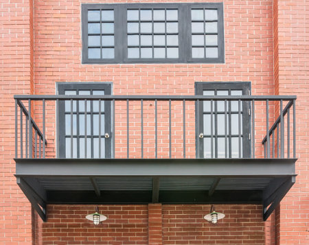 Balcony with brick wall