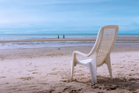 tropical beach background with beach chair on sand with beautiful blue sea and cloudy sky,Image for...