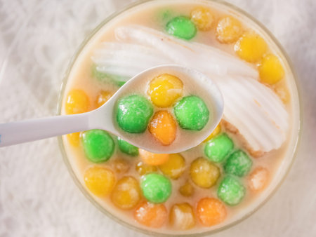 Dumplings in coconut cream (Bua Loi) on Thai silk, Dessert of Thailand.