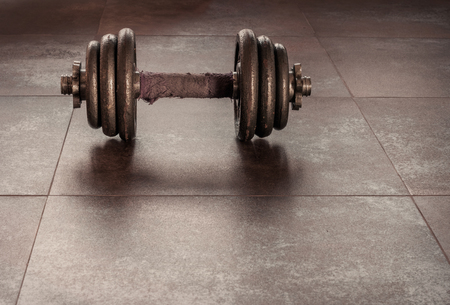 Dumbbell old laying on the ground.の写真素材