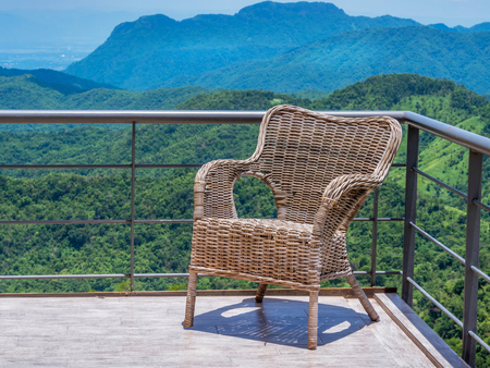 Wicker chair on the rooftop terrace of the mountain atmosphere.の写真素材