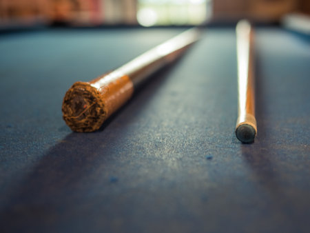 Snooker cue or pool cue on the table.