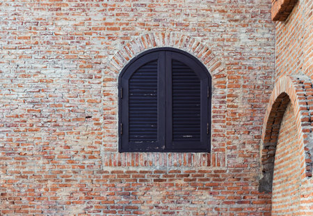 Windows with brick wall