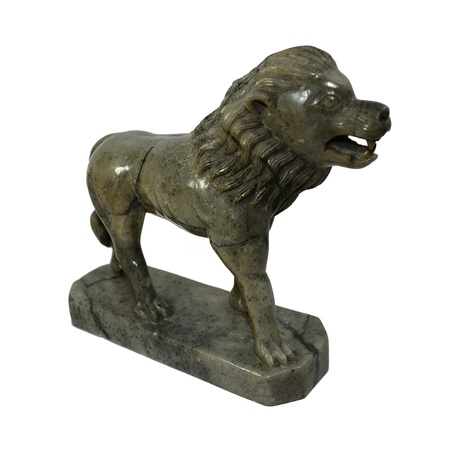 Ancient marble Sculpture of a male lion isolated on whiteの写真素材