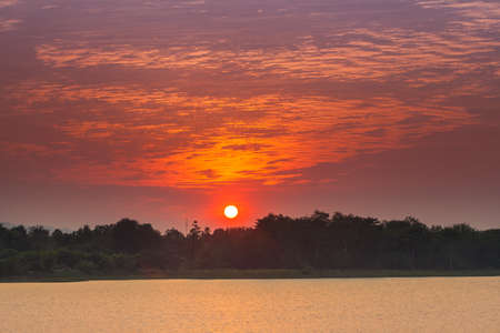 Sunset landscape with twilight at the lakeの写真素材