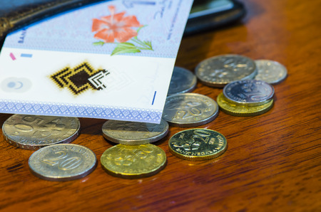 Malaysian ringgit coins and Malaysian ringgit notes on wood Tableの写真素材