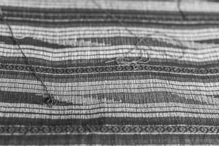 Weaving loom and shuttle on the warp.の写真素材