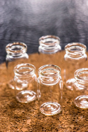 Set of Empty little bottles with cork background