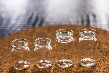 Set of Empty little bottles with cork backgroundの写真素材