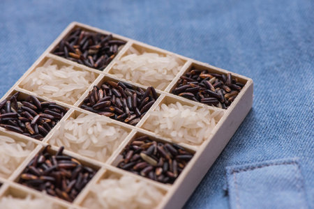 Wild black and white dry rice closeup macro shot on blue jeans, Sensitive focus