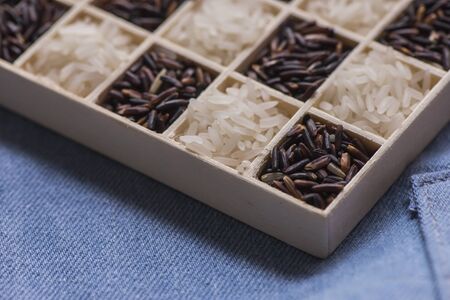 Wild black and white dry rice closeup macro shot on blue jeans, Sensitive focusの写真素材