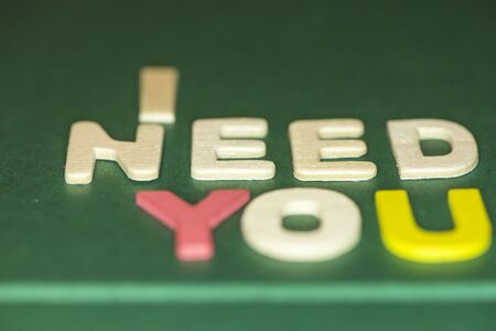 The word spelling to "I need you" on green background, Sensitive Focusの写真素材