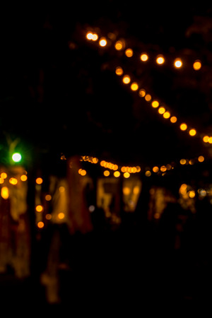 blur image of night festival on street blurred background with bokehの写真素材