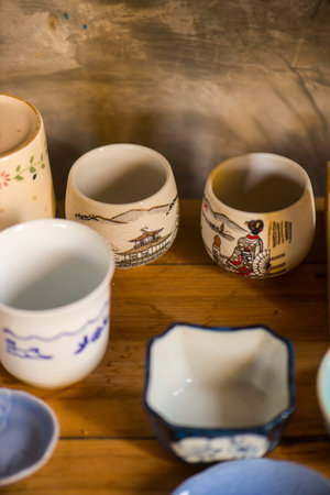 Handmade ceramic dishes on an old vintage table, Sensitive Focusの写真素材
