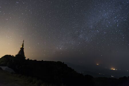 View of Phra Maha Dhatu Nabha Metaneedol and Phra Maha Dhatu Nabhapol Bhumisiri with milky way in galaxy, Chiangmai, Thailand.の写真素材