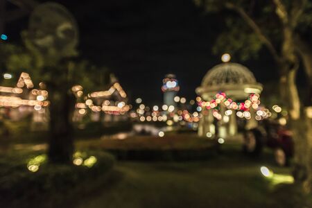 blur image of night festival on street blurred background with bokehの写真素材