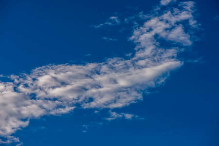 Fantastic soft white clouds against blue skyの写真素材