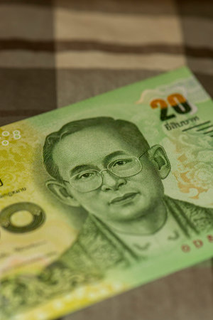 Close up of Thai banknote Thai bath with the image of Thai King. Thai banknote of 20 Thai baht on...