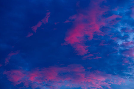 Blue sky with white and blue and pink clouds. Clear sky. Beautiful sky. Evening sky.