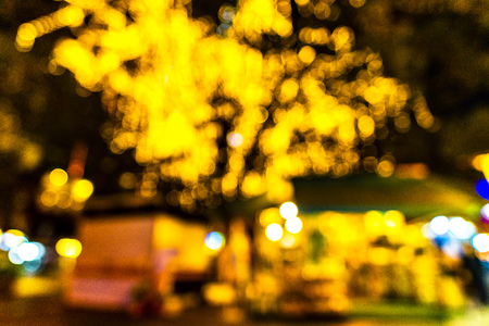 blur image of night festival on street blurred background with bokehの写真素材