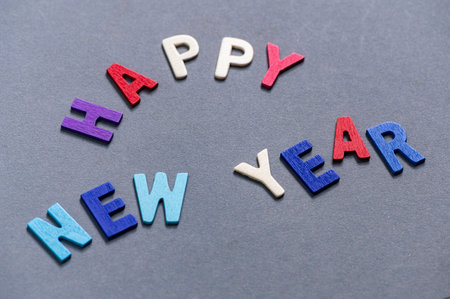 Happy new year font art colorful texting for greeting or celebrate card with gray background, Sensitive Focusの写真素材