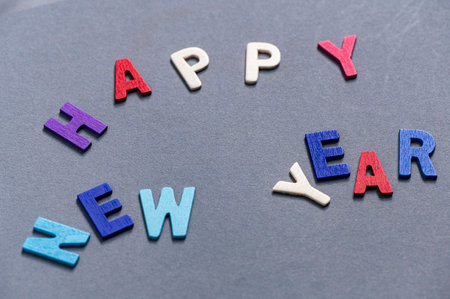 Happy new year font art colorful texting for greeting or celebrate card with gray background, Sensitive Focusの写真素材