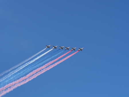 Flight of a group of SU-25 during the parade dedicated to the day of the Russian Navy. August 29, 2018. Saint Petersburg, Russia. A plume of smoke in the colors of the flag of Russia. Parade.の写真素材