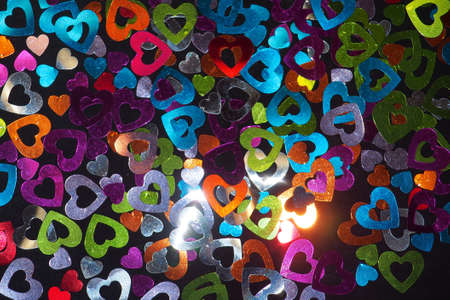 A large number of colorful shiny hearts. Background photo.の写真素材