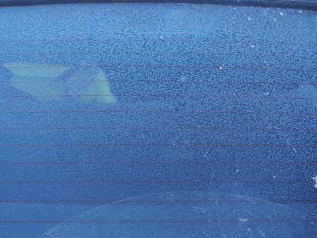 Crystals of frost on the glass of the car. After freezing. Winter.の写真素材