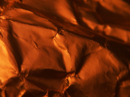 Golden metallic structure. The texture of the foil. Macrophotography.の写真素材