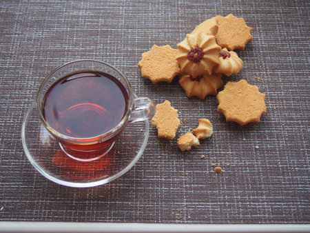 On the table is a glass Cup of tea and there is a huge amount. Still-life