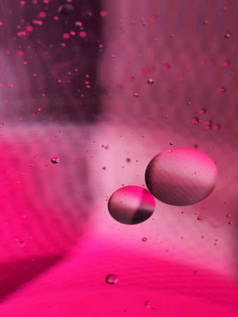 Abstract photography. Multi-colored circles on a multi-colored background. Red, yellow, pink, green, purple circles. Drops of oil on the water. Bokeh. The background photo.の写真素材