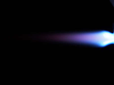 Photo of the flame of a gas burner torch on a black background. Close-up.の写真素材