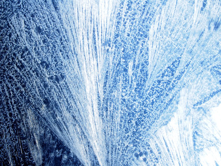 Frosty frost patterns on the glass. Macro photography.
