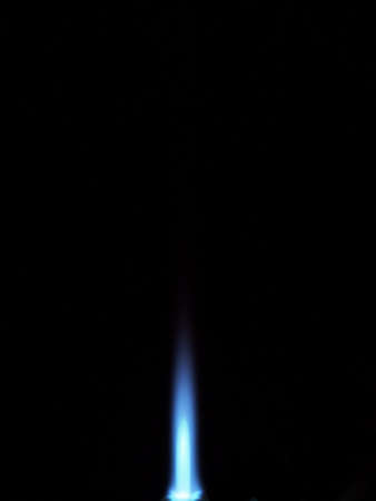Photo of the flame of a gas burner torch on a black background. close-up.の写真素材