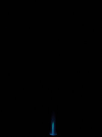Photo of the flame of a gas burner torch on a black background. close-up.