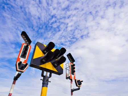 Train traffic light system with blue sky backgroundの写真素材