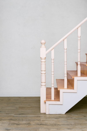 wooden stair to second floor with laminate wood like floor