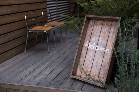 Rustic style wooden welcome sign in front of the storeの写真素材