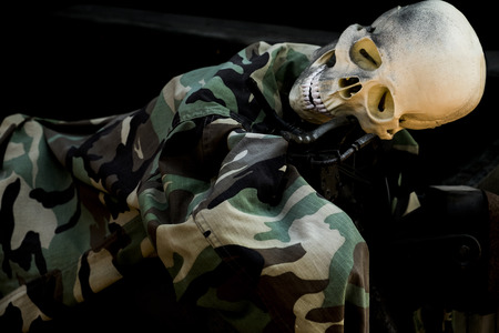 Dead skeleton in soldier uniform lyingの写真素材