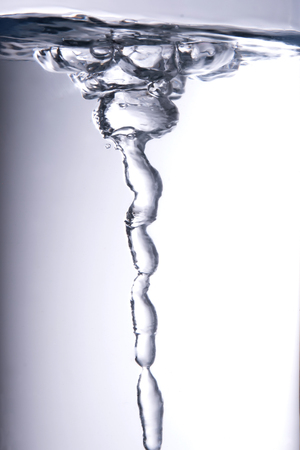 Still life water vortex on white backgroundの写真素材