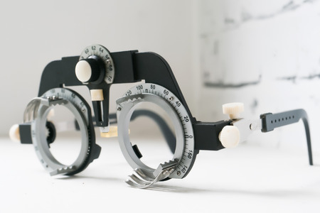 Manual eyes sight examination tools with a set of trial lenses for a phoropter used for eye examの写真素材