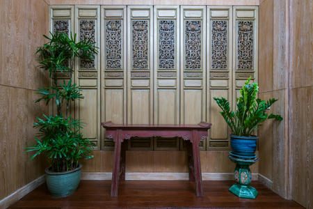 Thai style decoration of living room with table and tree potsの写真素材